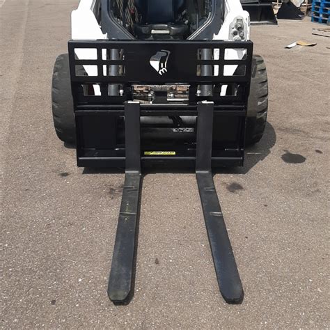 skid steer forks with thumb|universal skid steer forks.